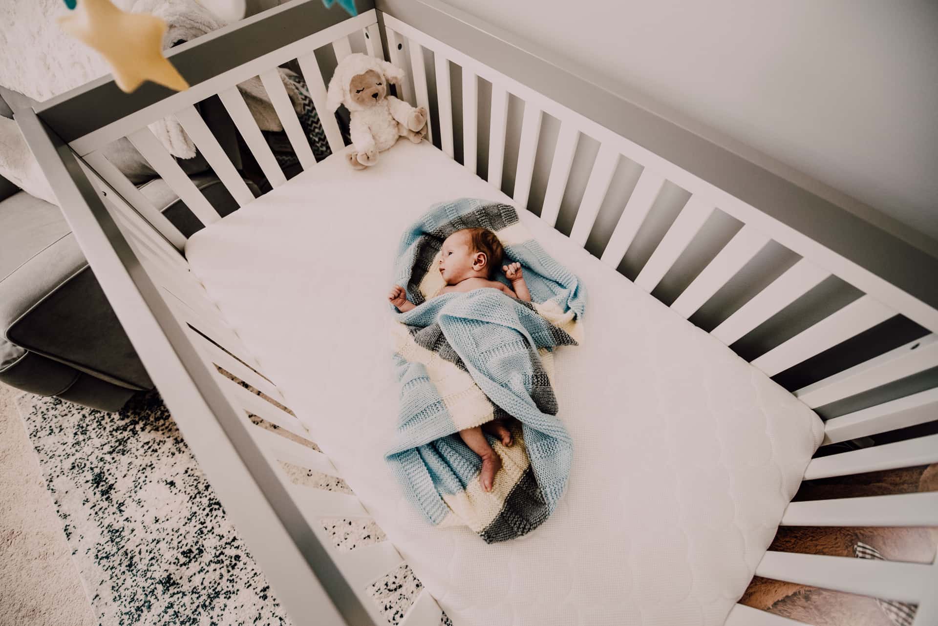 A baby monitor camera watching over a crib